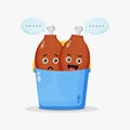 Cute chicken thighs mascot in bucket Royalty Free Stock Photo