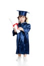 Cute child in academician clothes with roll