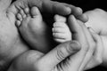 Cute child baby babe little foot in the father hands. Classical closeup shot about family values and parents child children love. Royalty Free Stock Photo