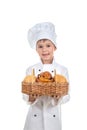 Cute Child Boy Bakery With Basket of Sesame and Raisin Buns, isolated on white Royalty Free Stock Photo