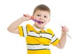 Cute little kid boy brushing teeth, isolated on white Royalty Free Stock Photo