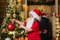 Cute child boy decorating Christmas tree. Happy child with Christmas bauble. Cute little kids celebrating Christmas Royalty Free Stock Photo