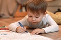 Cute child boy drawing with pencils in preschool Royalty Free Stock Photo