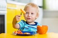 Cute child boy eats healthy food vegetables Royalty Free Stock Photo