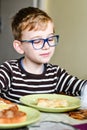 Cute child at breakfast Royalty Free Stock Photo