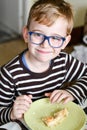 Cute child at breakfast Royalty Free Stock Photo