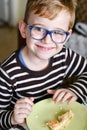 Cute child at breakfast Royalty Free Stock Photo