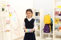 Cute child choosing school stationery