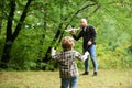Cute child with dad play with toy plane. Father& x27;s day. Dad and baby son playing together outdoors toy airplane. Royalty Free Stock Photo