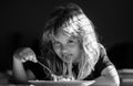 Cute child eating breakfast at home. Cute little kid eating spaghetti pasta at home. Close up portrait of funny kid Royalty Free Stock Photo