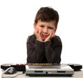 Cute child with electric piano and laptop Royalty Free Stock Photo