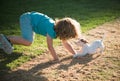 Cute child enjoying with her best friend dog. Funny doggy game. Kids playing with his pet dog. Royalty Free Stock Photo
