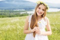 Cute child girl at camomile field Royalty Free Stock Photo