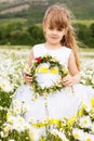 Cute child girl at camomile field Royalty Free Stock Photo