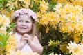 Cute child girl in flowers