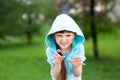 Cute child girl poses outdoors with scary face