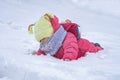 Cute child girl on snow. Winter outdoor activities Royalty Free Stock Photo