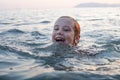 Cute child girl swiming on in the sea and having fun Royalty Free Stock Photo