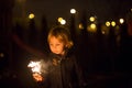 Cute child, holding sparkler at new year eve in garden Royalty Free Stock Photo