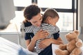 Cute child hugging nurse at hospital Royalty Free Stock Photo