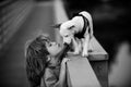 Cute child kissing puppy. Puppies dod playing. Royalty Free Stock Photo