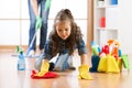 Cute child little girl with mother cleanse a floor in nursery at home