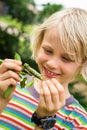 Cute child looking at a caterpillar Royalty Free Stock Photo