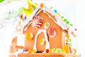 Cute, child-made gingerbread house, with imperfections a real gingerbread house assembly, for the Christmas holiday season, as a Royalty Free Stock Photo