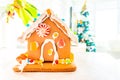 Cute, child-made gingerbread house, with imperfections a real gingerbread house assembly, for the Christmas holiday season, as a Royalty Free Stock Photo