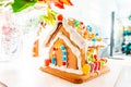 Cute, child-made gingerbread house, with imperfections a real gingerbread house assembly, for the Christmas holiday season, as a Royalty Free Stock Photo