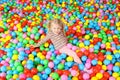 Cute child playing in ball pit Royalty Free Stock Photo