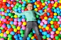 Cute child playing in ball pit Royalty Free Stock Photo