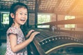 Cute child playing stringed instruments and having fun.