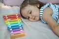 Cute blond child playing with xylophone at home. Creativity and education concept. Royalty Free Stock Photo