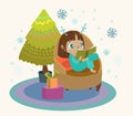 Cute child reading a book in a large armchair, a Christmas tree