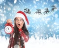 Cute little child and Santa Claus flying in his sleigh against moon sky on background Royalty Free Stock Photo