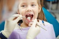 Cute child sits at dentist chair with smile Royalty Free Stock Photo