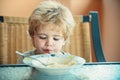 Cute child with spaghetti. Funny boy eats pasta. Lunch for preschooler.