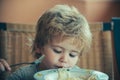 Cute child with spaghetti. Lunch for children. Child with pasta fork