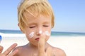 Cute child with sunscreen at the beach