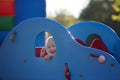 Cute child, toddler boy, playing on the playgroung on cute car