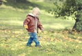 Cute child walks in autumn park