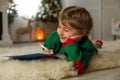 Cute child writing letter to Santa Claus at home. Christmas tradition