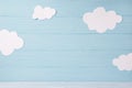 Cute children or baby card, white clouds on the blue wooden background Royalty Free Stock Photo