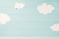 Cute children or baby card, white clouds on the light blue wooden background, tonned Royalty Free Stock Photo