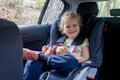 Cute children, boy and girl siblings, sitting in car seats in car, traveling. Family going to vacation
