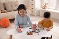 Cute children coloring drawings at table Royalty Free Stock Photo