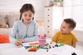 Cute children coloring drawings at table Royalty Free Stock Photo