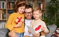 Cute children congratulating happy daddy with Fathers day and giving him handmade greeting postcard Royalty Free Stock Photo