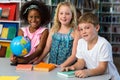 Cute children with globe on table Royalty Free Stock Photo